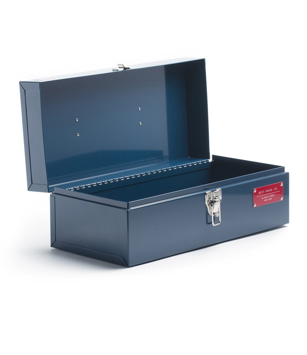 A blue metal toolbox with an open lid and a latch in the front. The interior is empty, and a red label is attached to the front panel.