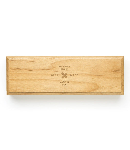 Wooden rectangular box with the text Arkansas Stone, Best Made, Made in USA engraved on the lid.