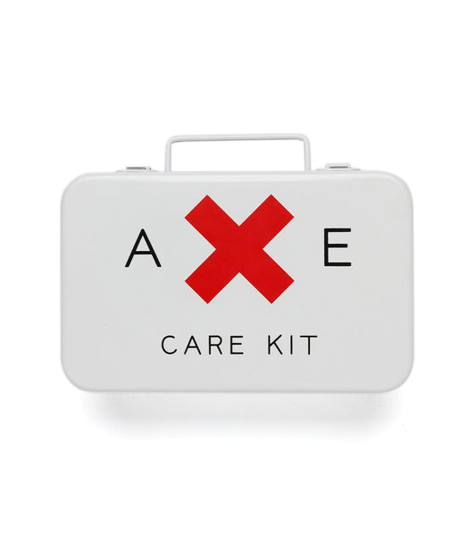 A white care kit box with a red X between the letters A and E and the words CARE KIT below it.