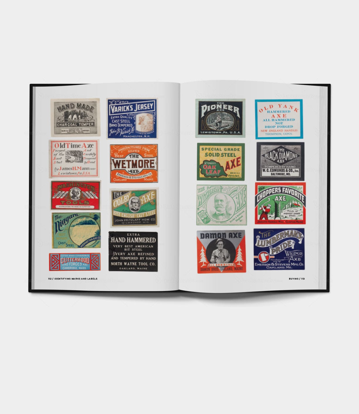 Open book displaying various vintage axe labels in different colors and designs, arranged in rows on two facing pages. The labels include brand names, logos, and product descriptions.