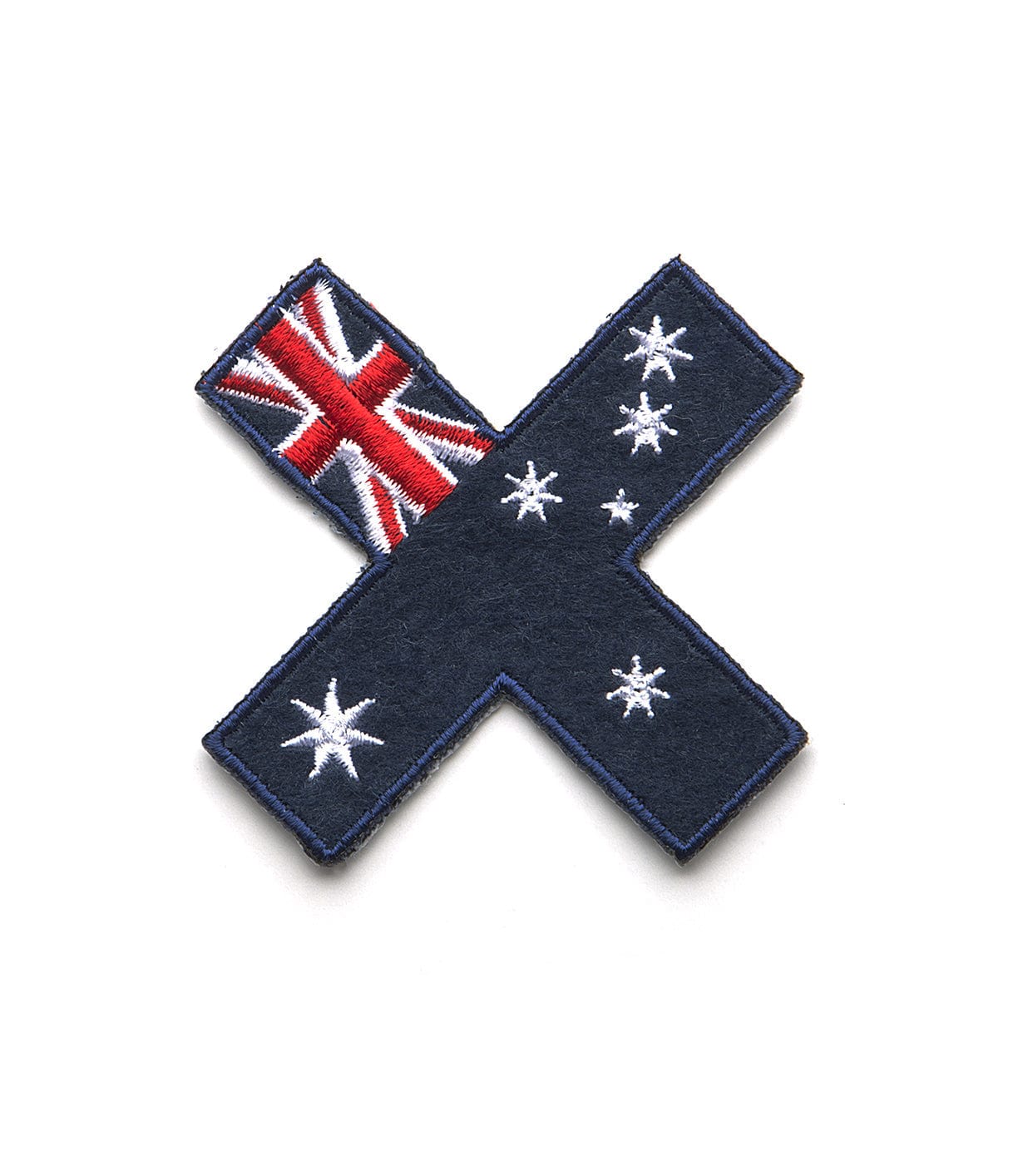 Fabric patch shaped like an X, featuring elements of the Australian flag and a white star constellation on a blue background.