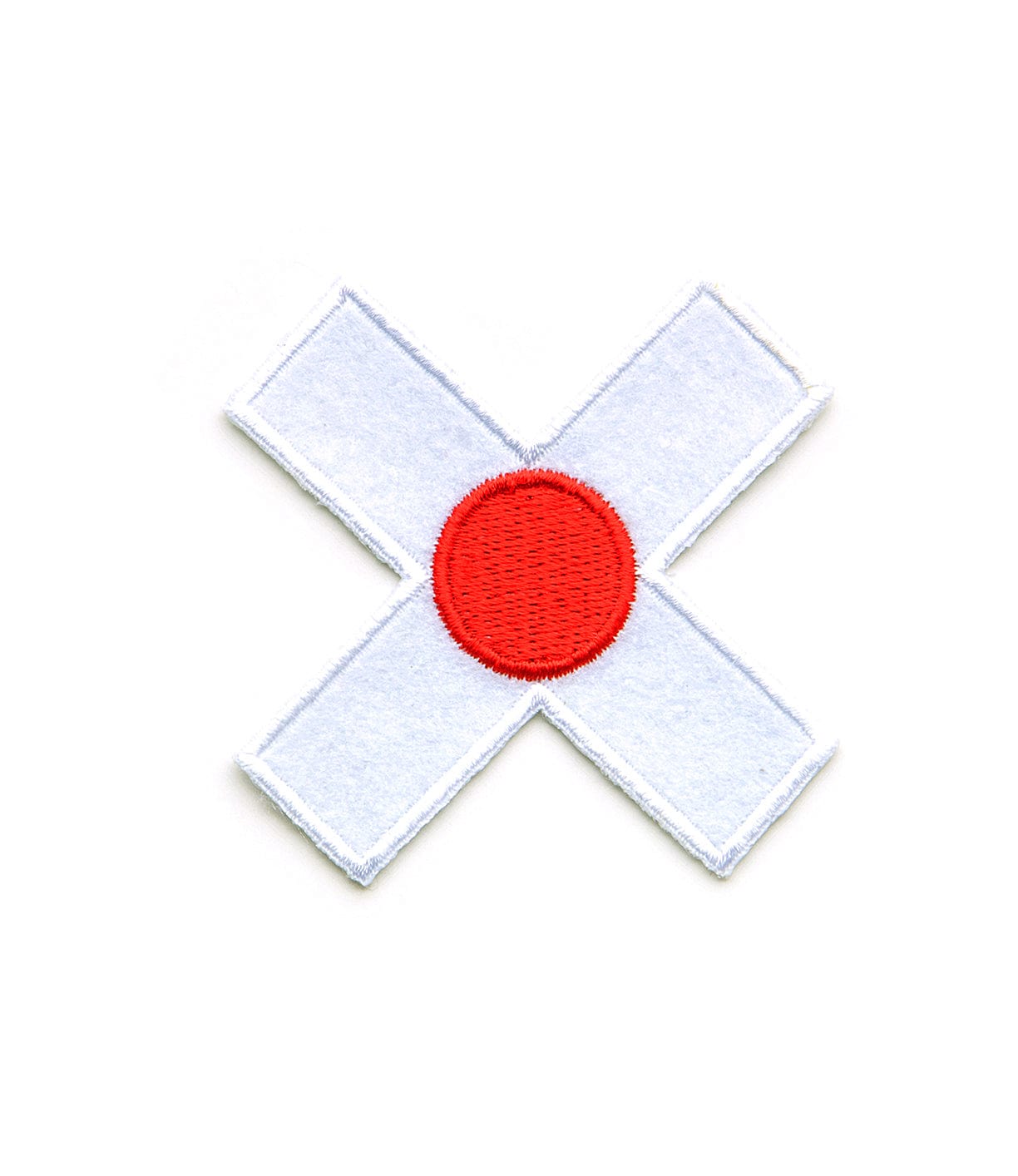 A white fabric patch in the shape of a cross with a red circle in the center.