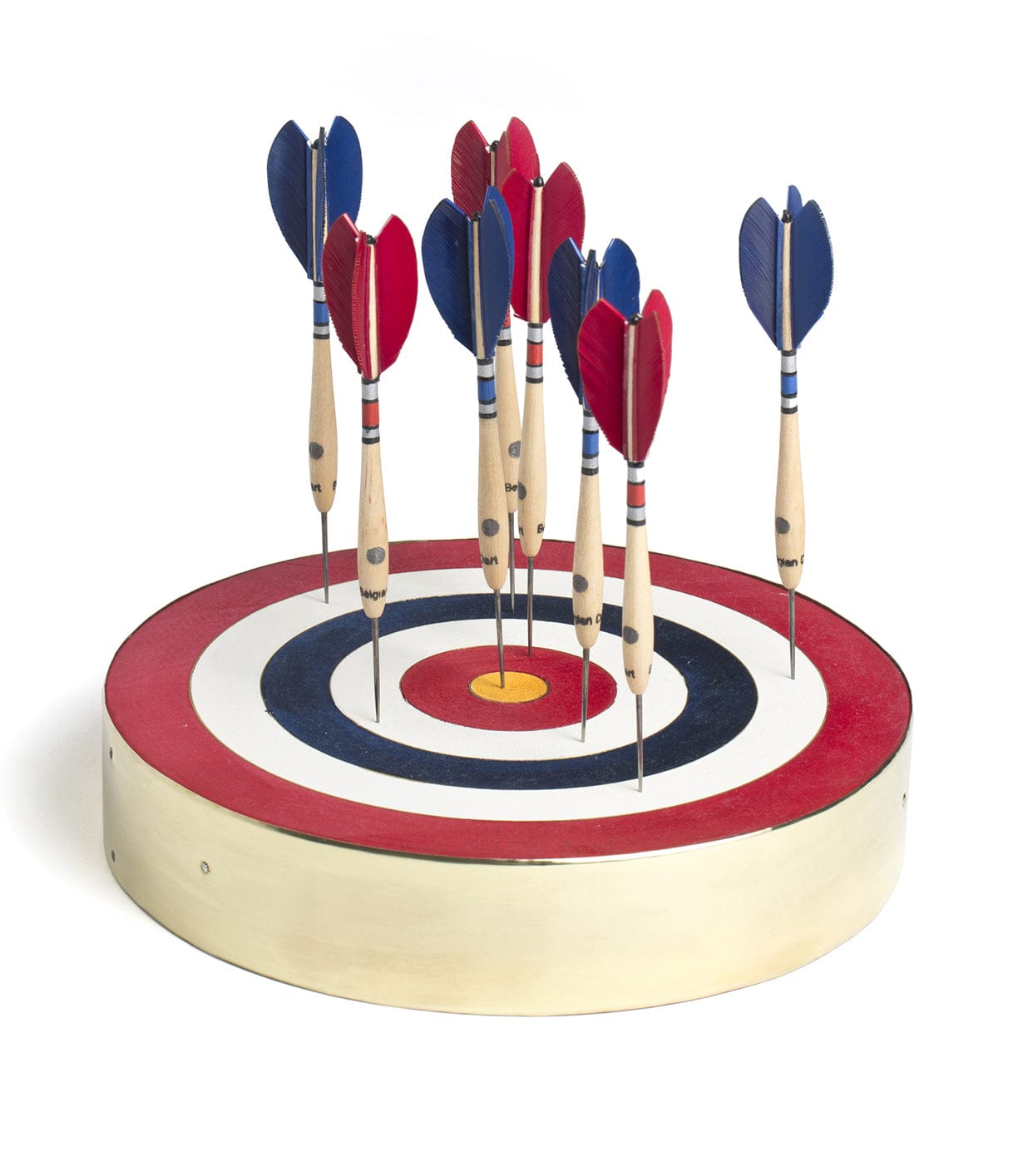 A wooden target board with multiple darts stuck in its bullseye area. The darts have blue and red flights.