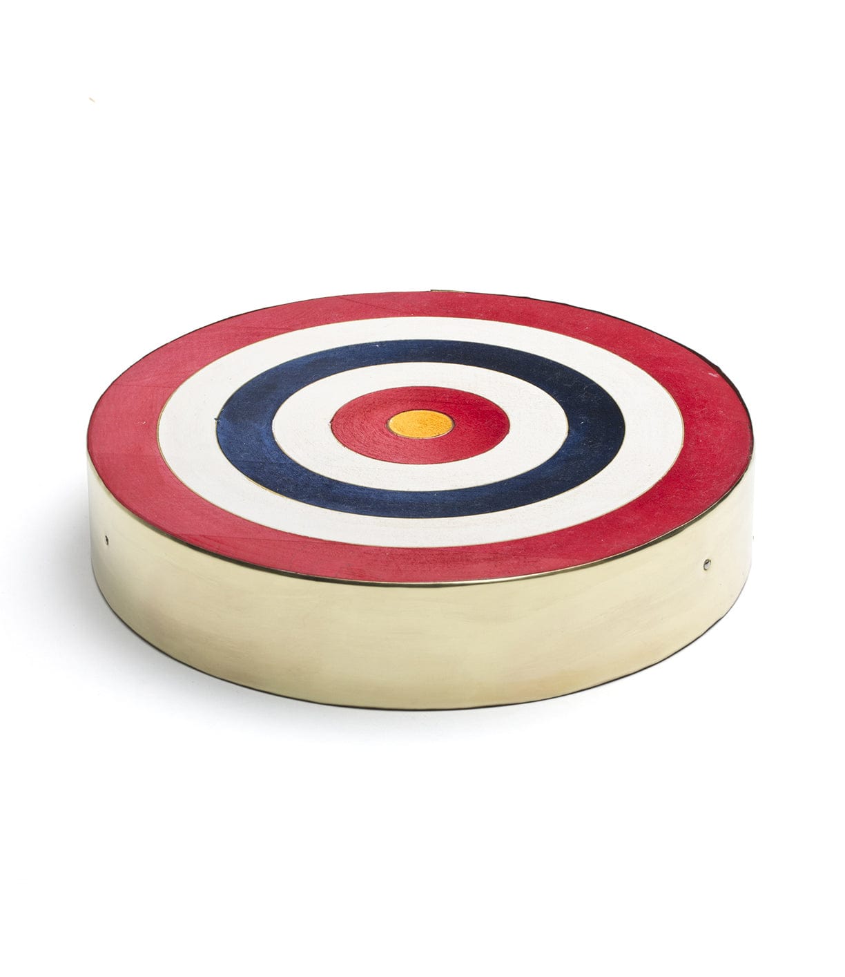 A round target with concentric circles in red, blue, black, white, and yellow on a beige base.