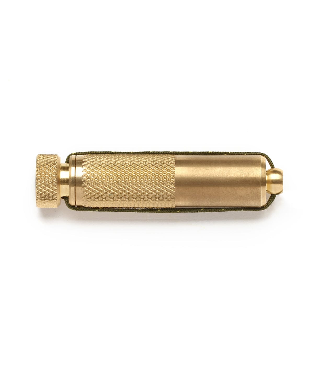 A cylindrical brass tool with a textured grip and a knurled cap, lying horizontally on a white background.