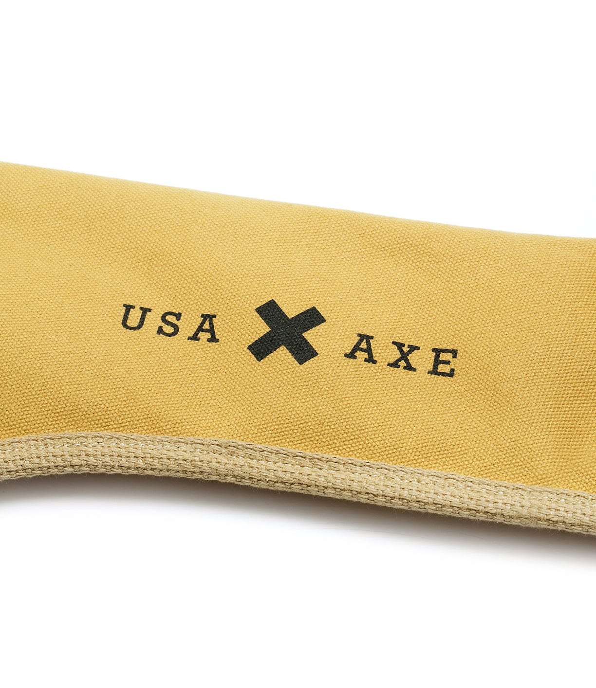 A section of a yellow canvas fabric with the text USA X AXE printed in black, displayed in a minimalist design.