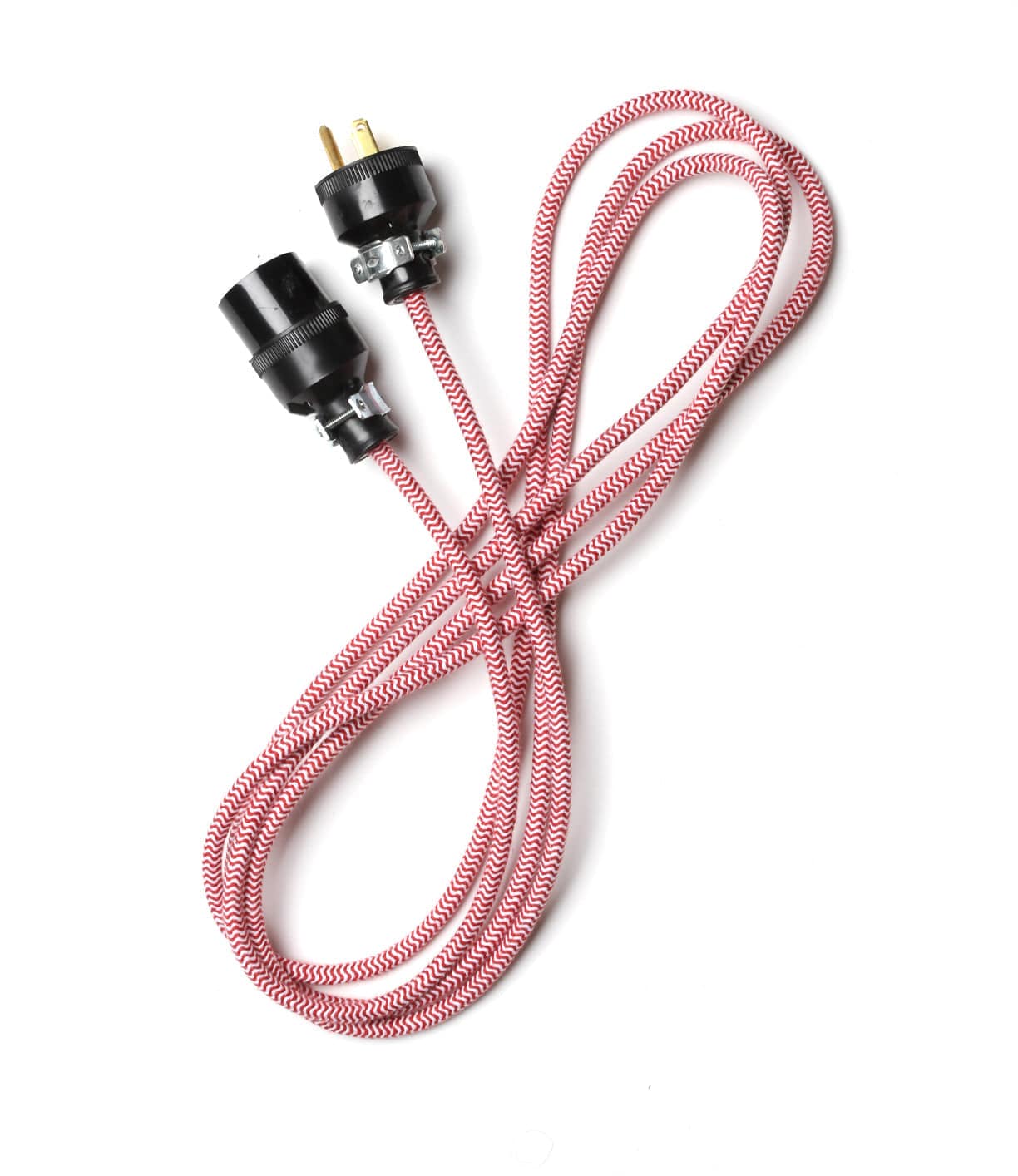 A red and white braided electrical power cord with black connectors at both ends is coiled on a white background.