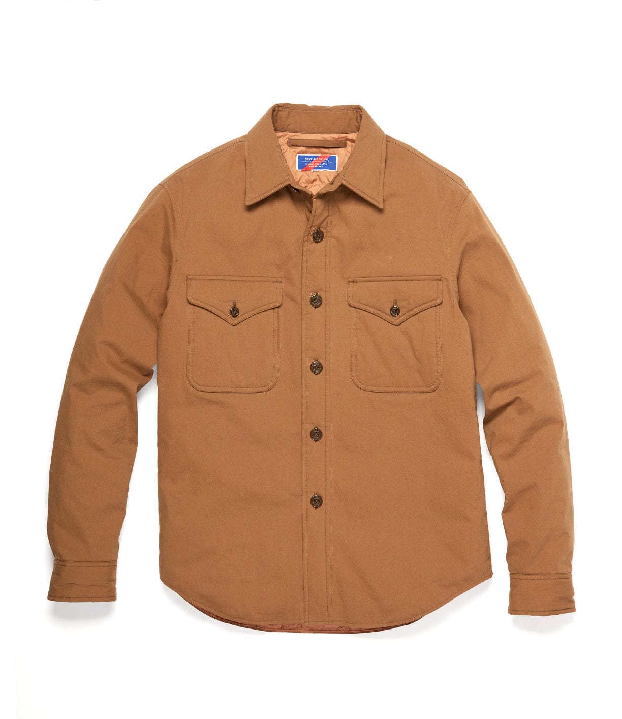 A tan, long-sleeved button-up shirt with two chest pockets.