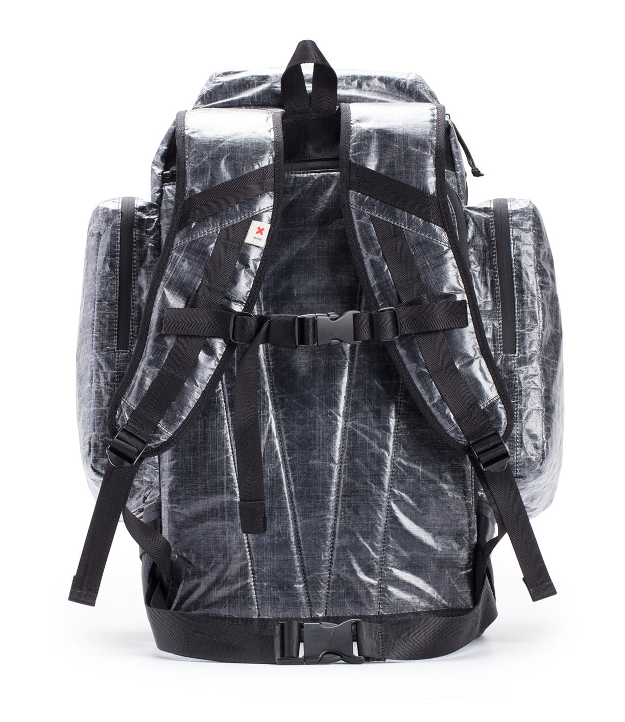 A transparent, rectangular backpack with multiple compartments and adjustable black straps.