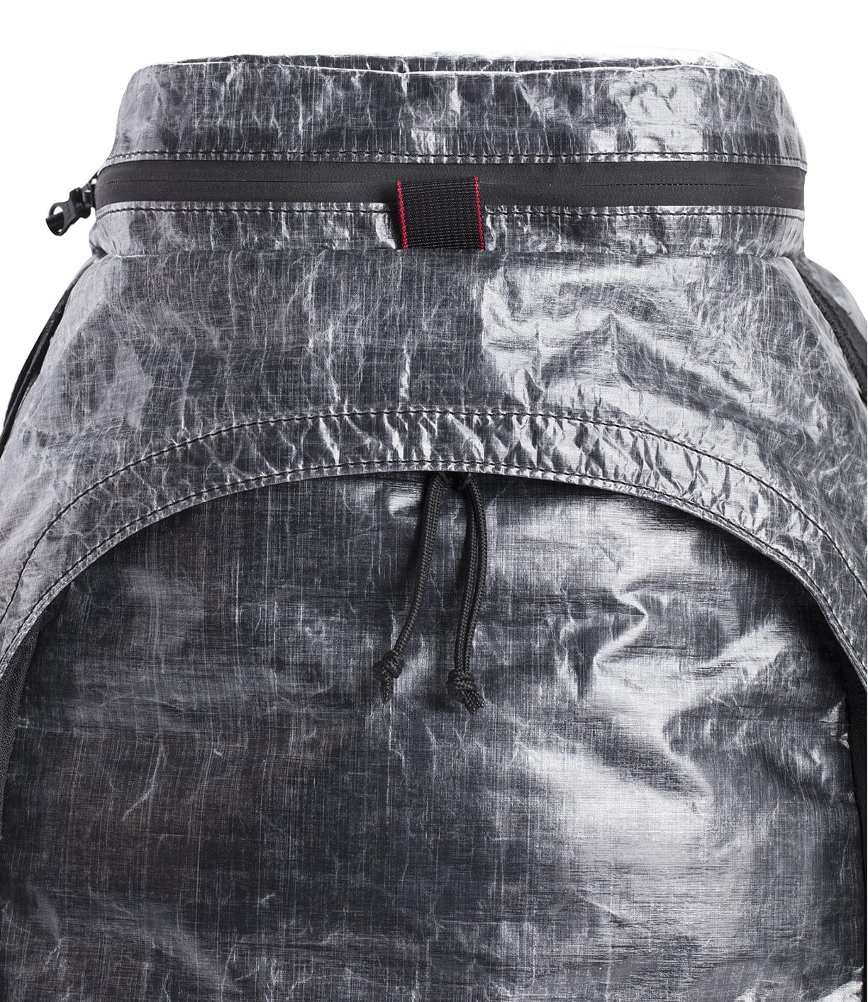 A close-up view of a black, weathered backpack with a zipper and adjustable drawstrings. The material appears textured and durable.