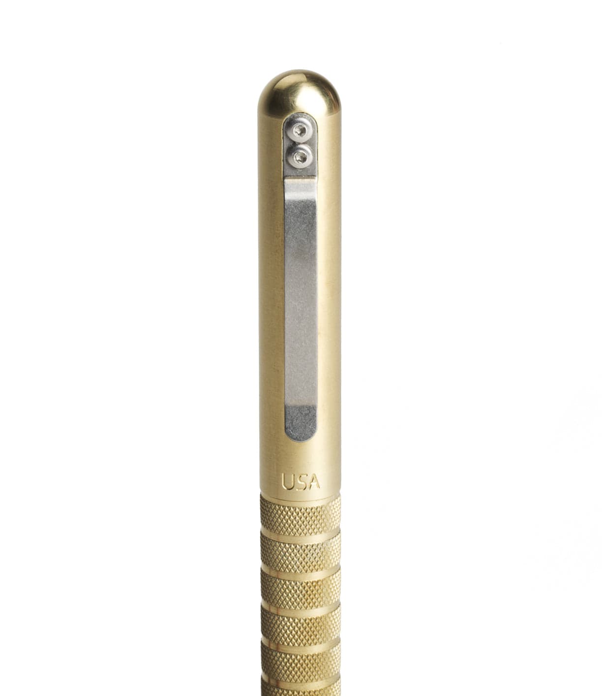 Close-up of a brass pen with a clip and engraved with USA on the body. The pen has a ribbed grip section for handling.