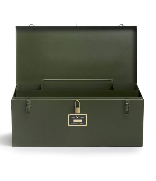 An open olive green metal storage trunk with a hinged lid, interior compartment, latch closures, and a small nameplate on the front.