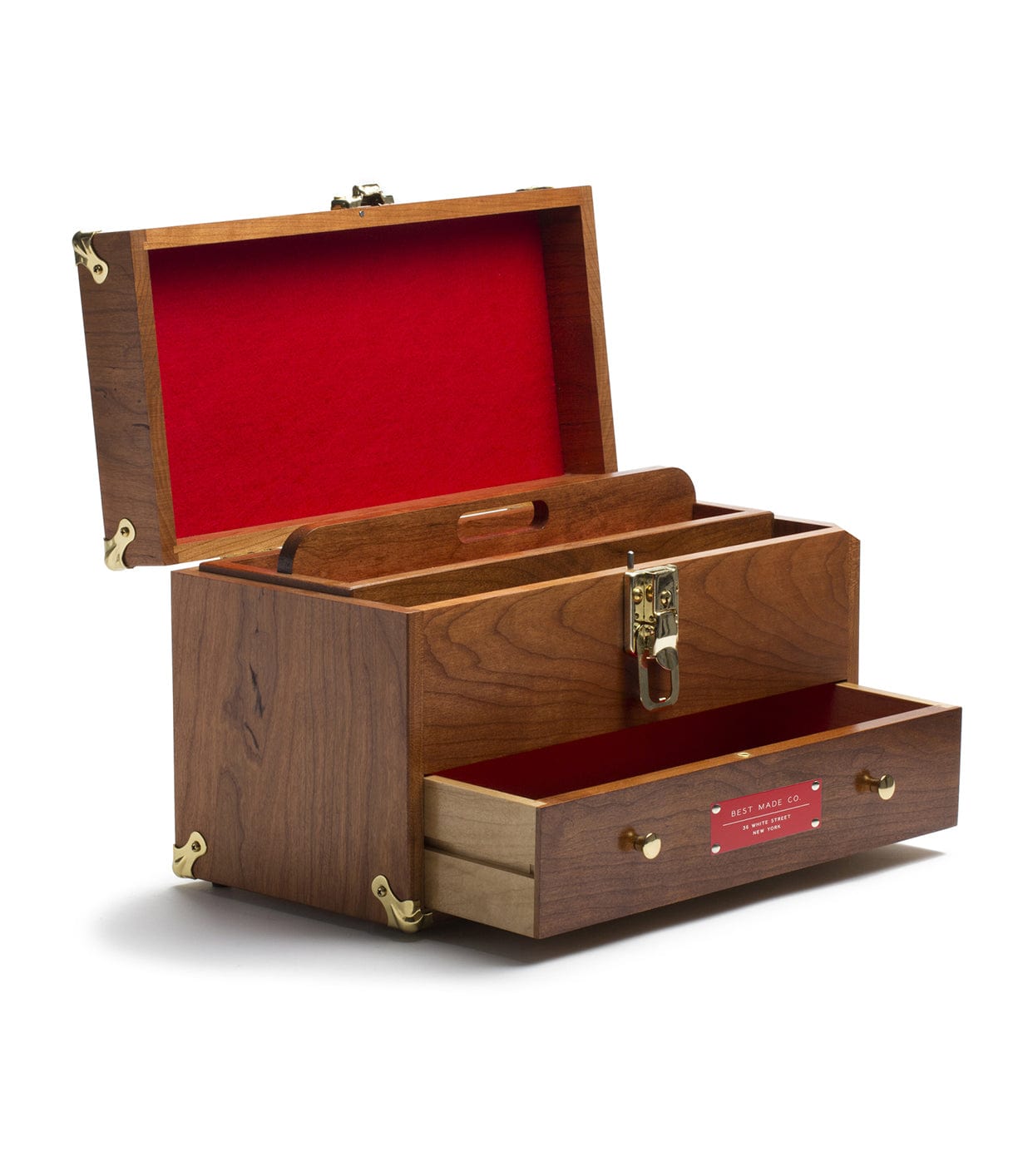 A wooden toolbox with an open lid, revealing a red felt-lined interior and separate compartments, including a pull-out drawer at the bottom. The box features brass accents and a lockable latch.