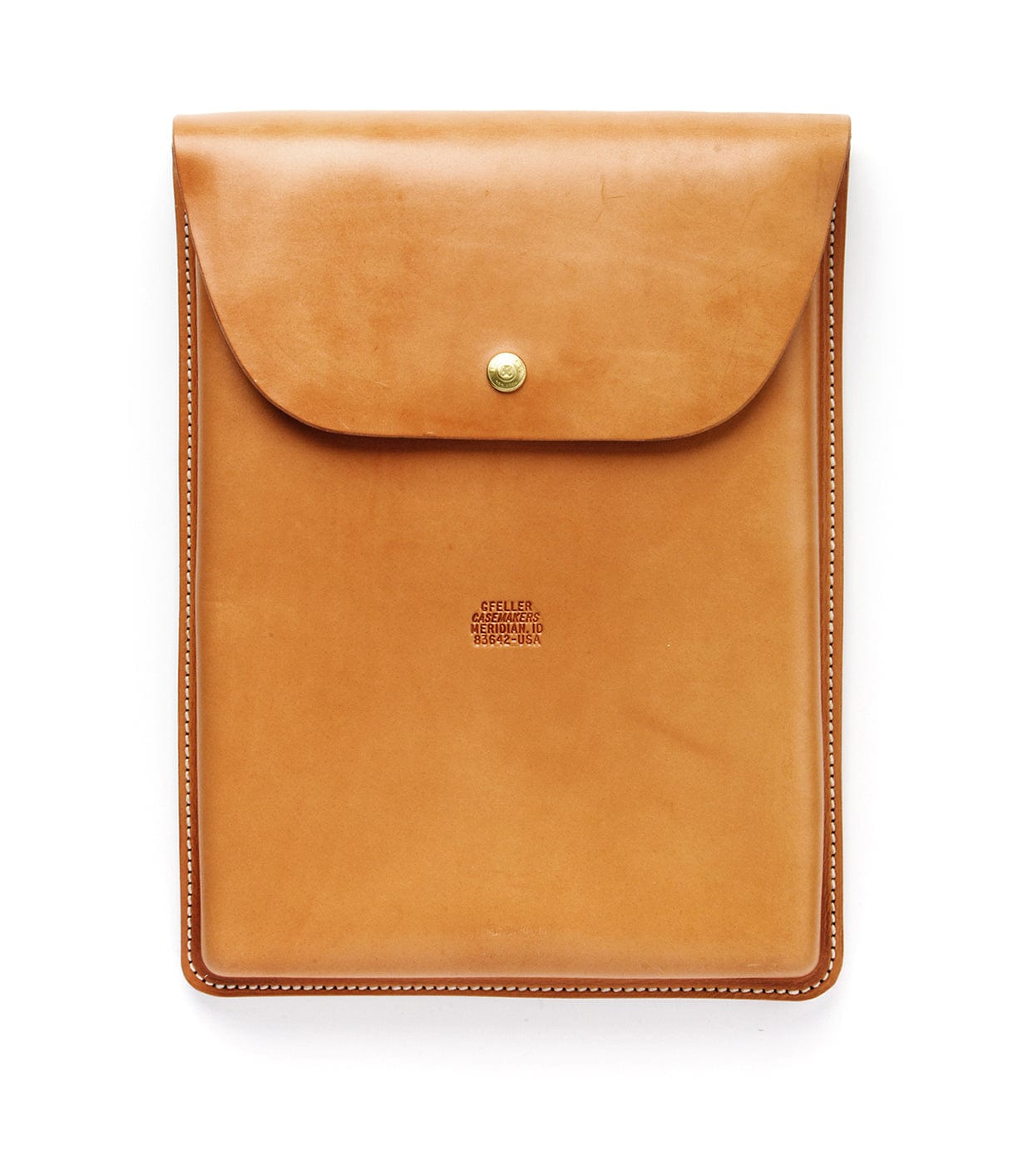 A tan leather envelope-style sleeve with a single brass snap closure and white stitching, featuring the embossed text GFELLER CASEMAKERS SINCE 1946.