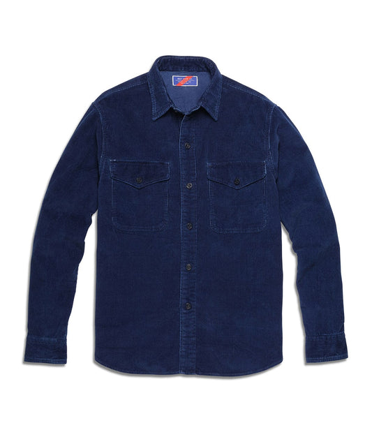 A long-sleeve, navy blue corduroy shirt with a button-front closure and two buttoned chest pockets.