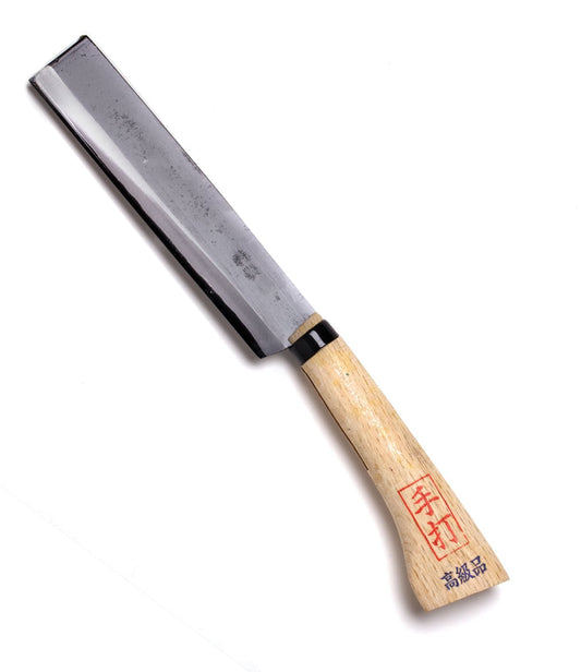 A Japanese-style chisel with a wooden handle and a metal blade, featuring Japanese characters on the handle.