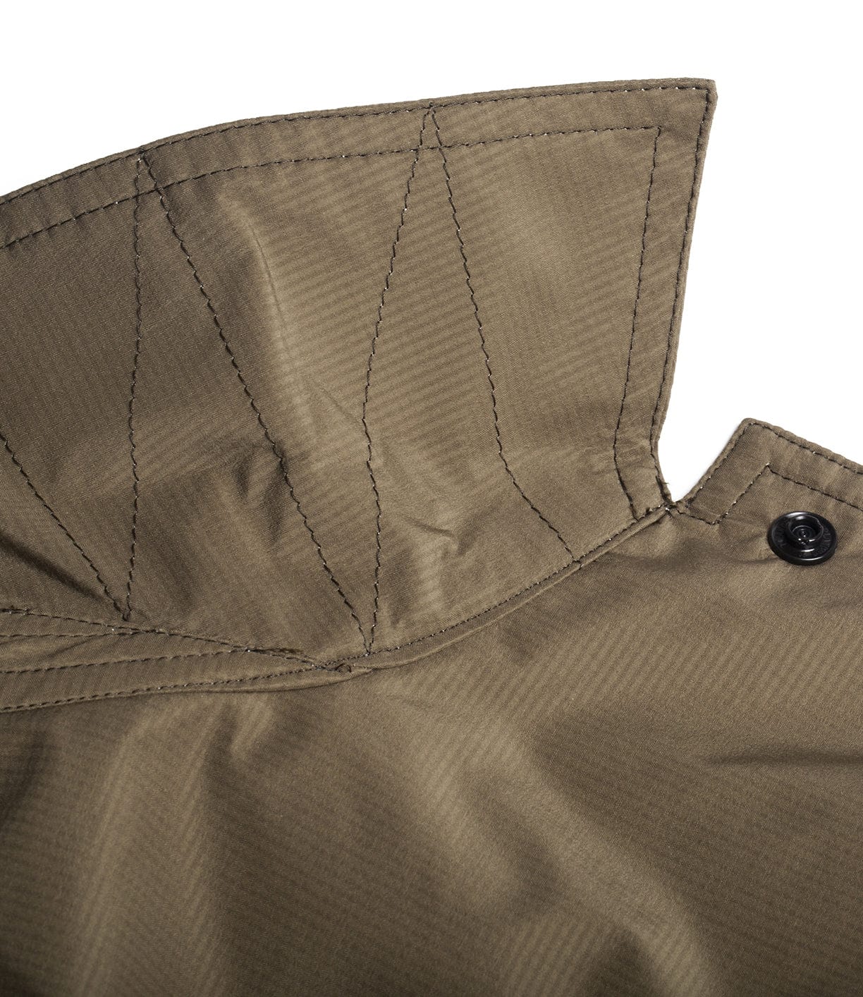 Close-up of the collar and neckline of an olive-green jacket, featuring visible stitching and a black button on the right side.