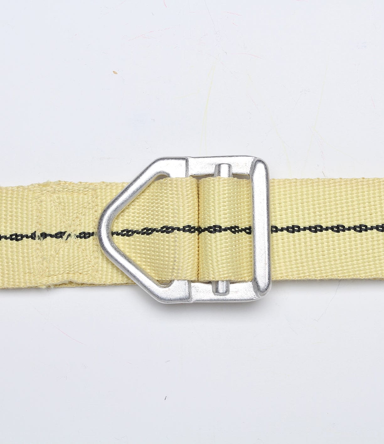 A close-up image of a beige nylon strap with a silver D-ring buckle, against a white background.