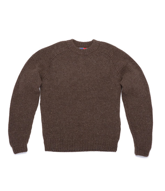 A brown, long-sleeved, ribbed-knit sweater is laid flat against a white background. The sweater has a crew neck and a simple design.