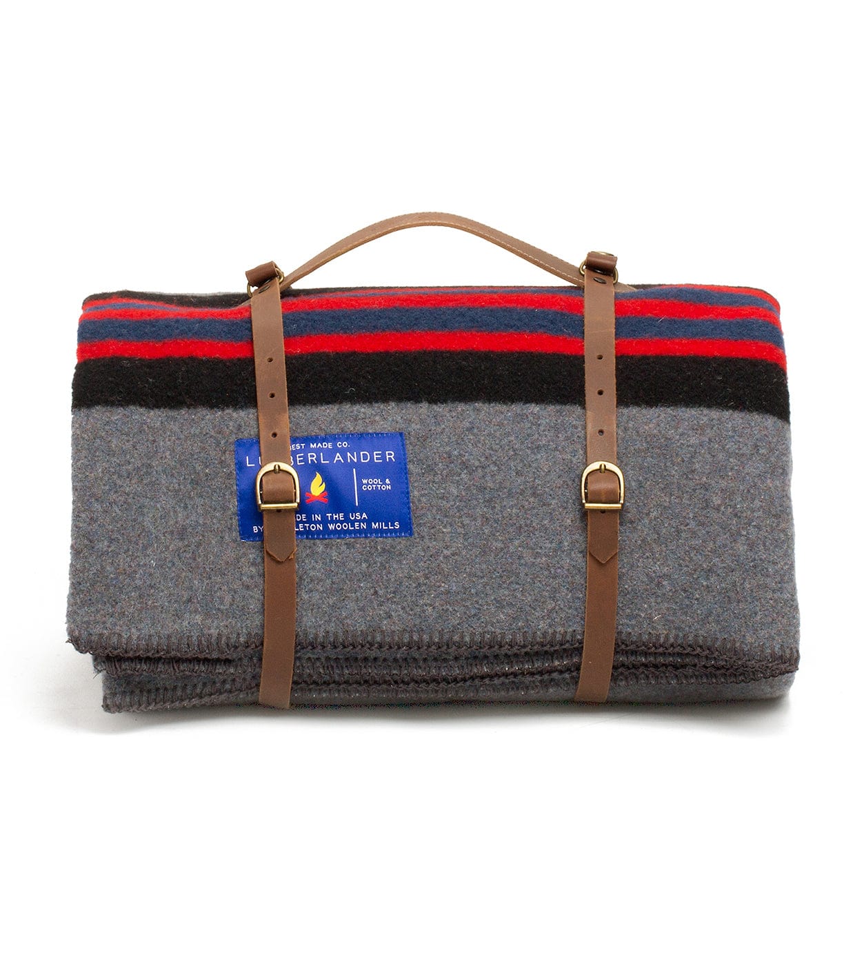 A folded grey blanket with red and black stripes, secured by brown leather straps and a handle, featuring a blue label with text.