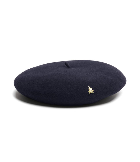 A black beret with a small gold emblem on the side.