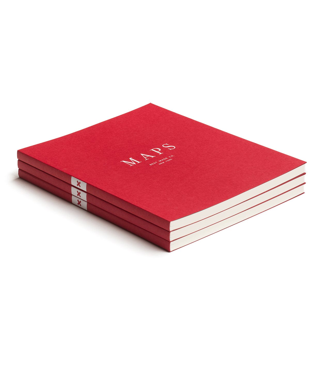 A stack of three red notebooks with MAPS written in white on the cover, each notebook bound with white tape with red stars.