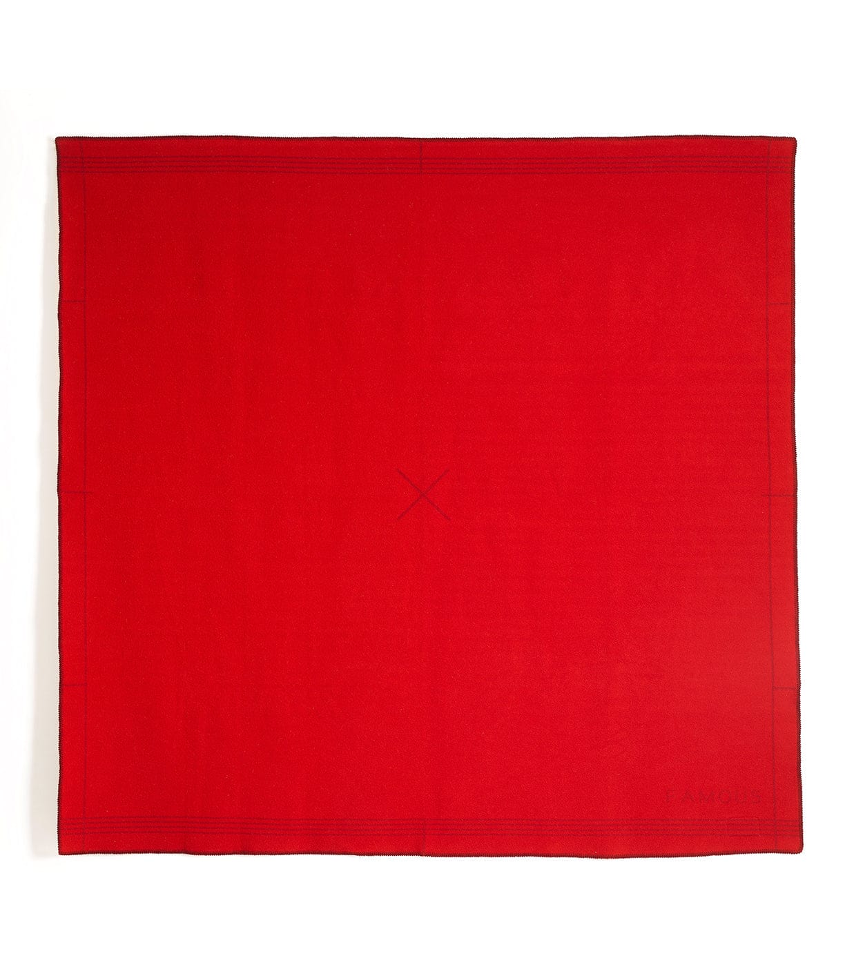 A large square red cloth with neatly stitched edges and a faint X pattern in the middle.