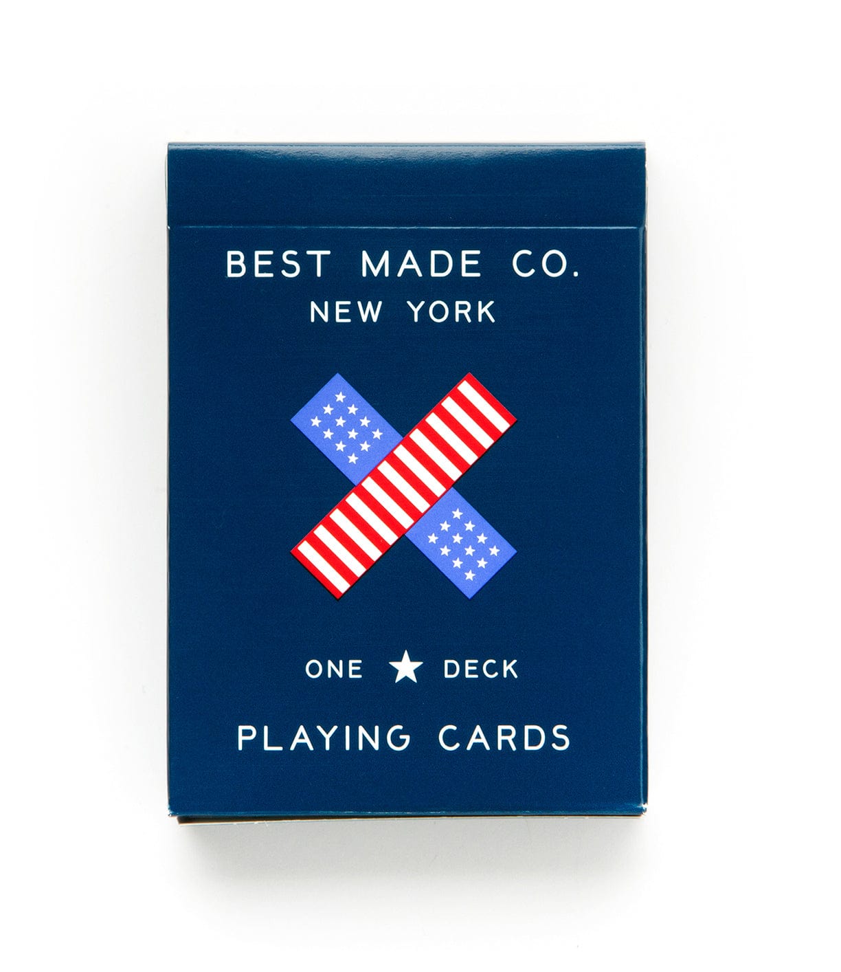 A navy blue box of playing cards from Best Made Co., New York, featuring a design of two crossed red, white, and blue striped patterns. Text reads One Deck Playing Cards.