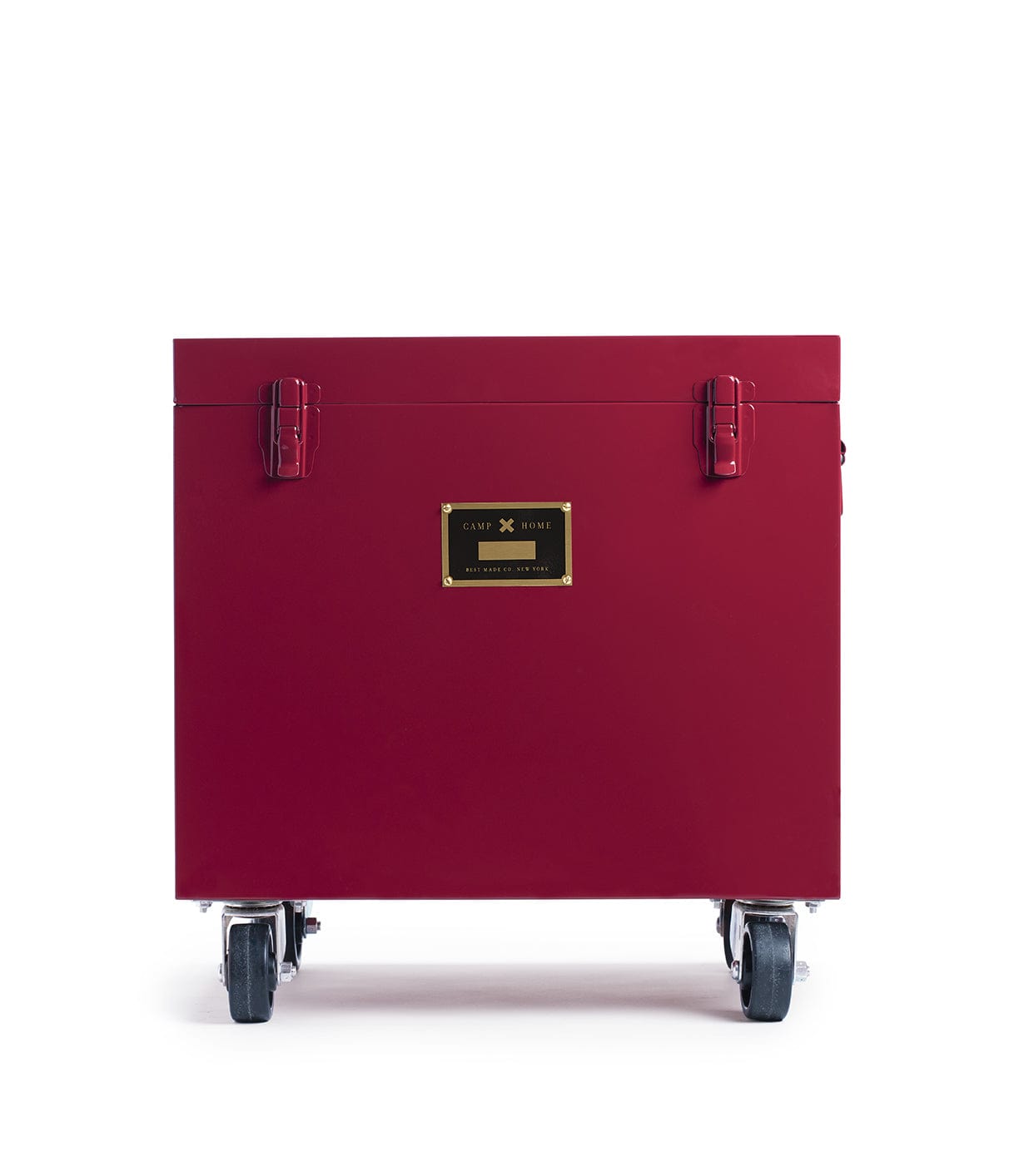 A red rectangular container with a black and gold label on its front, featuring latches and wheels for mobility.