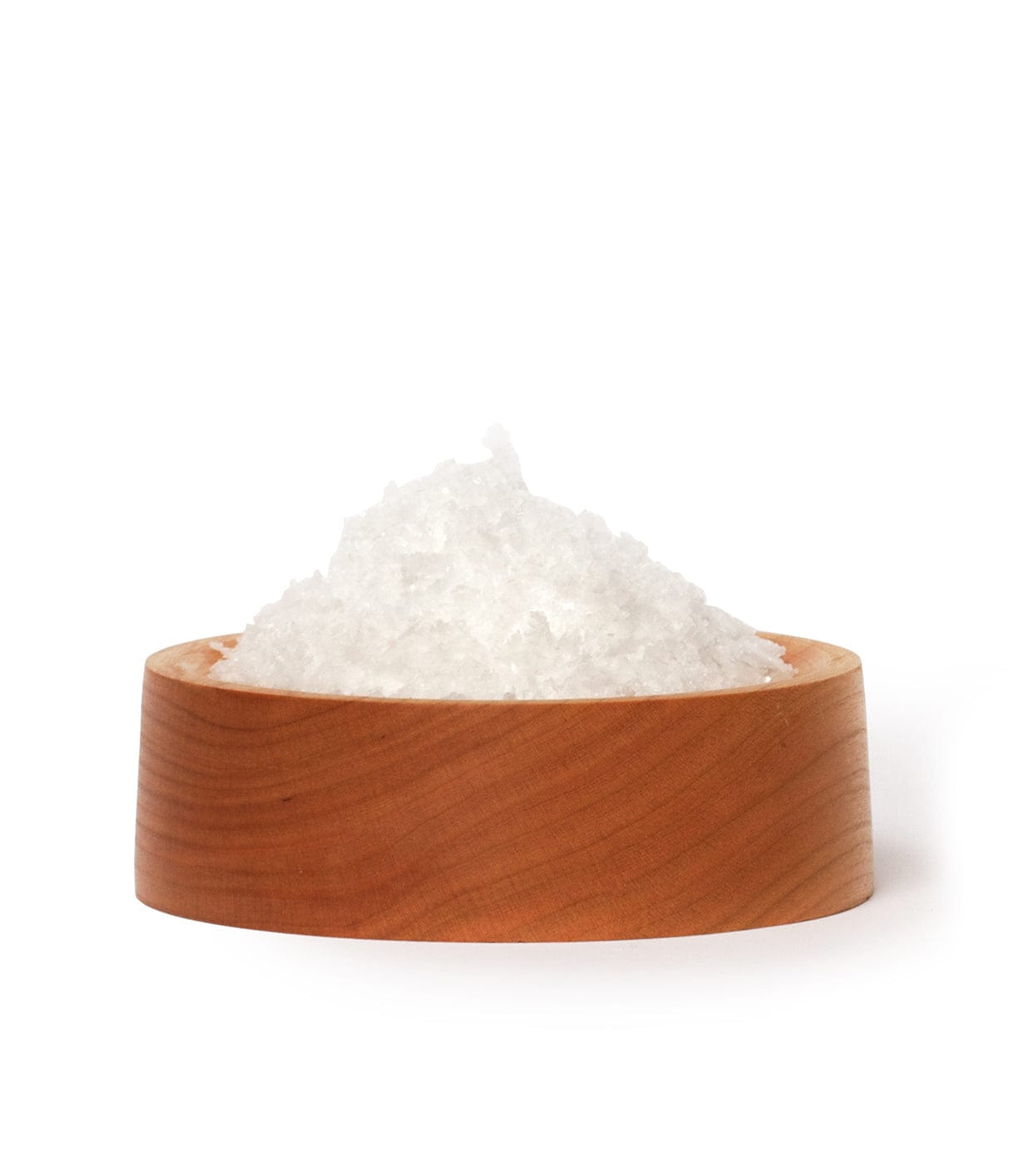 A wooden bowl filled with coarse white sea salt.