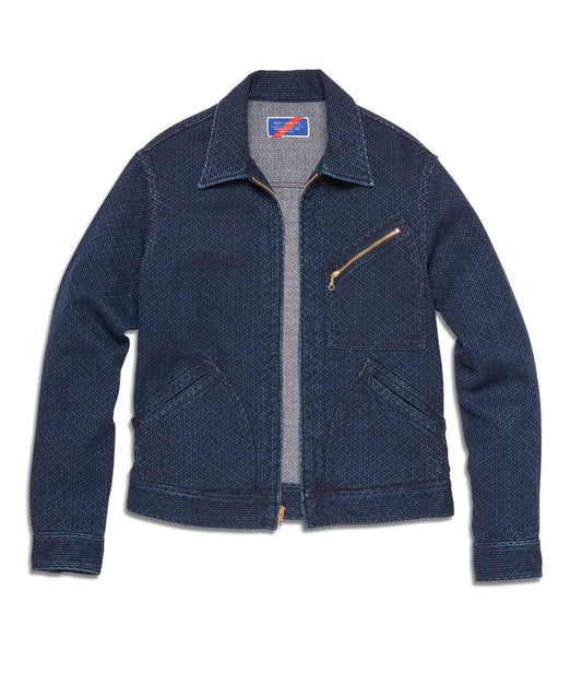 A blue denim jacket with a front zipper, a chest pocket with a zipper, and two side pockets.