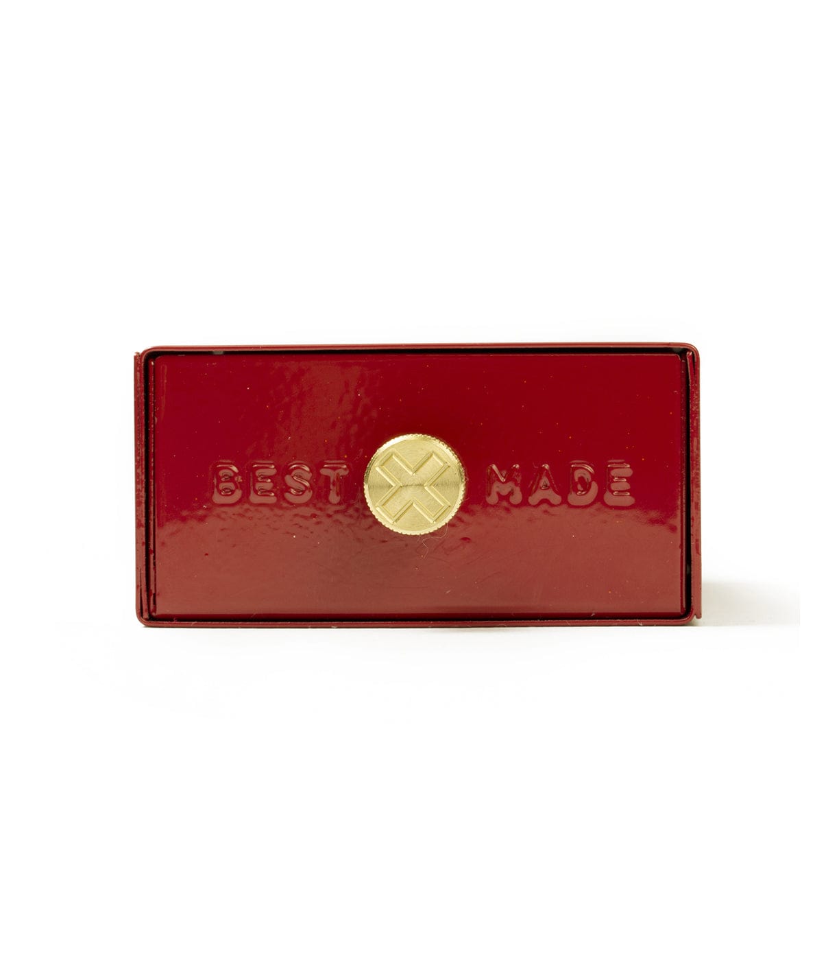 A red rectangular metal box with BEST MADE embossed on the front and a circular golden emblem in the center.