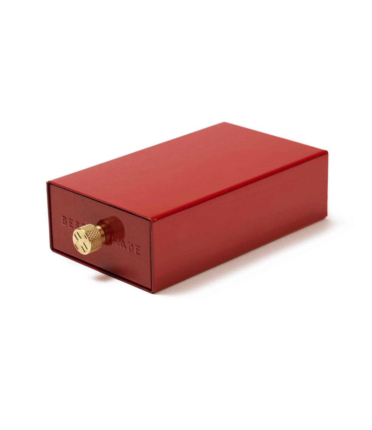 A small rectangular red metal box with a single gold dial on one end and the text BERKSHIRE embossed on its surface.