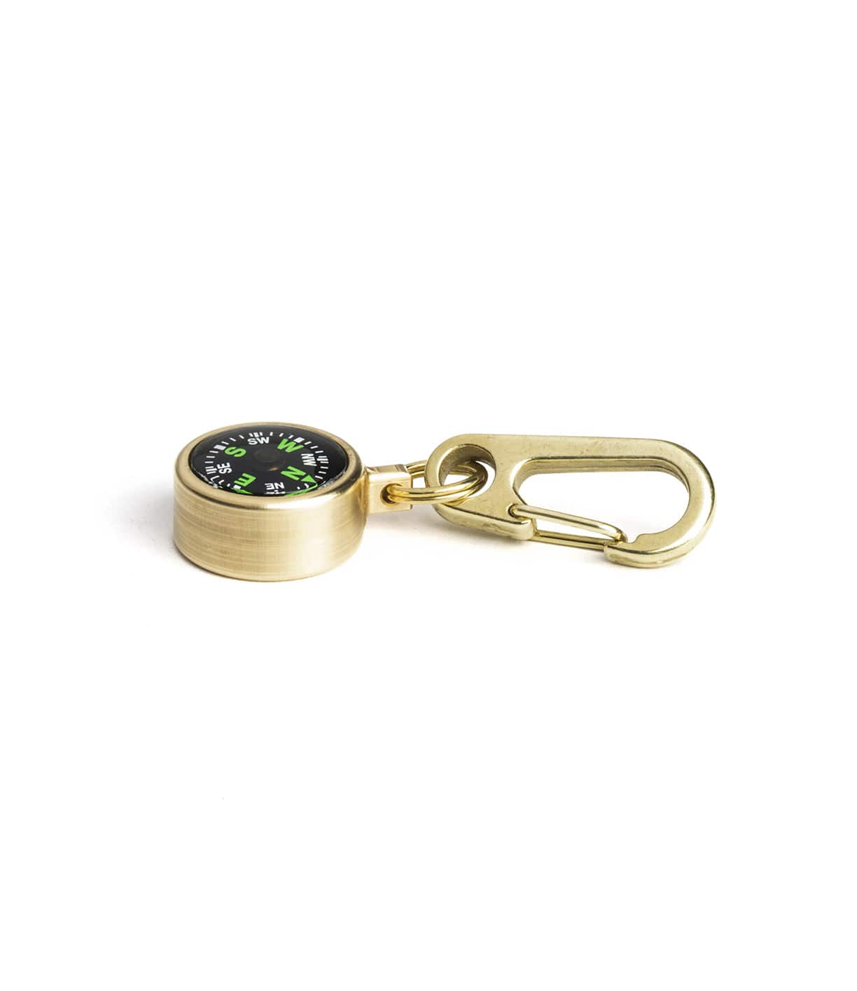 A brass compass keychain with a carabiner clip on a white background. The compass face is black with green and white markings.