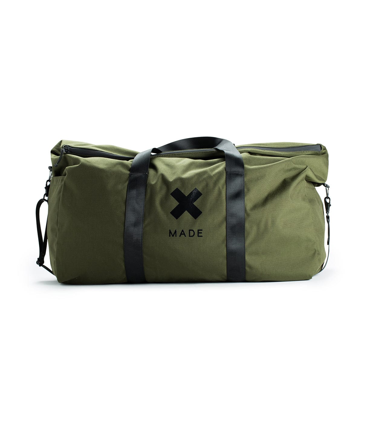 A large green duffel bag with black handles and a black X MADE logo on its side.